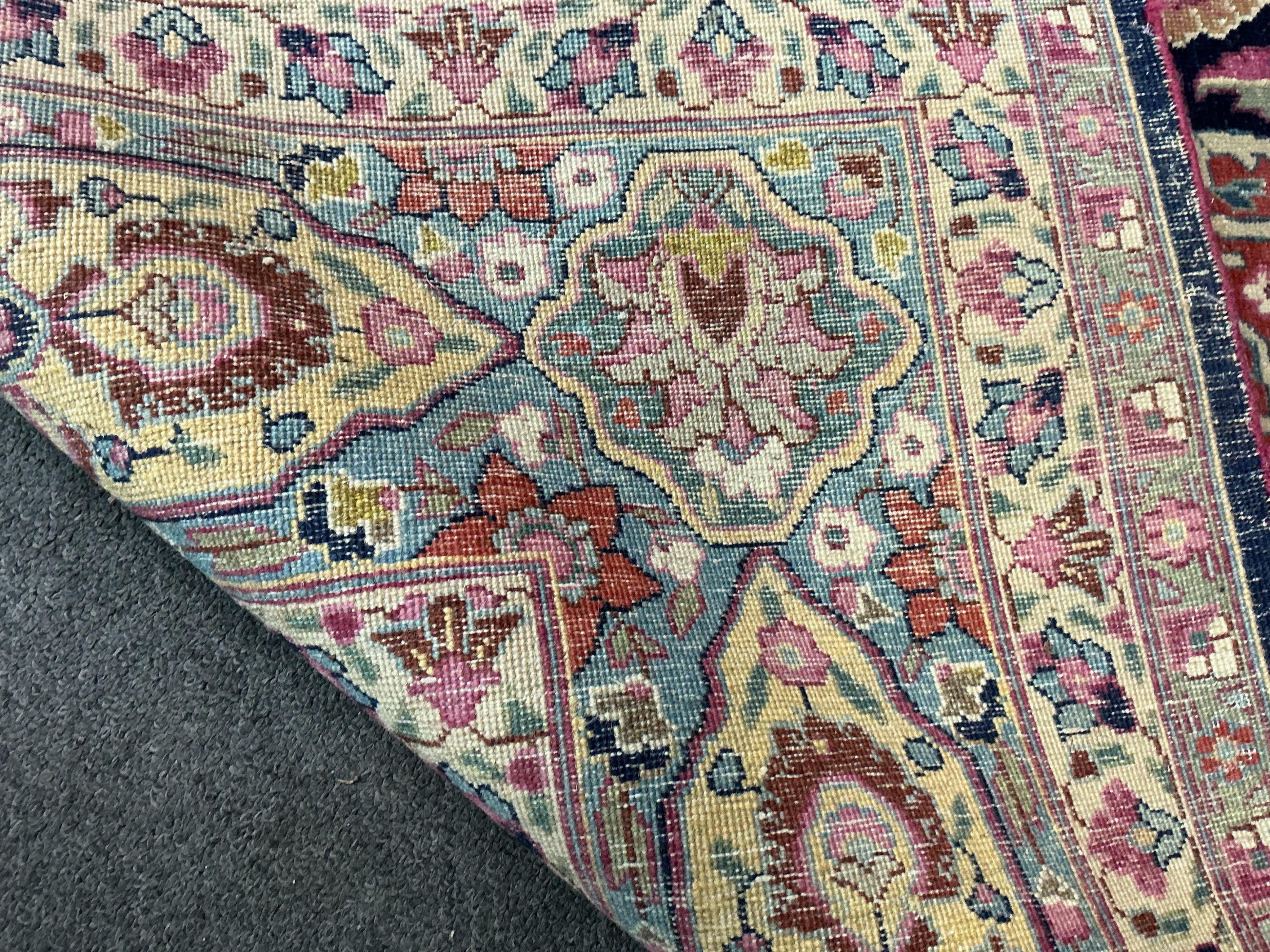 An early 20th century Kashan blue ground carpet, 315 x 206cm